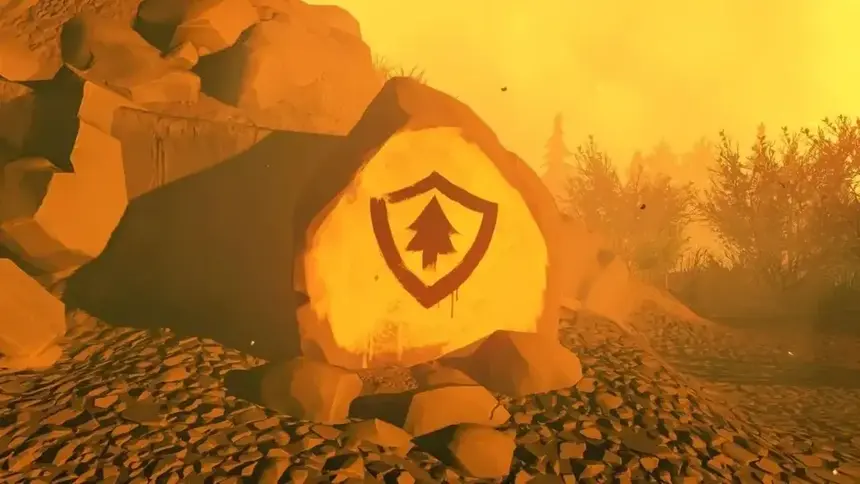 Photo of rock spray painted with the logo of the game Firewatch, which can is found at the end of the game